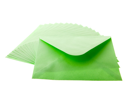 many green envelopes isolated over white backgroundの写真素材