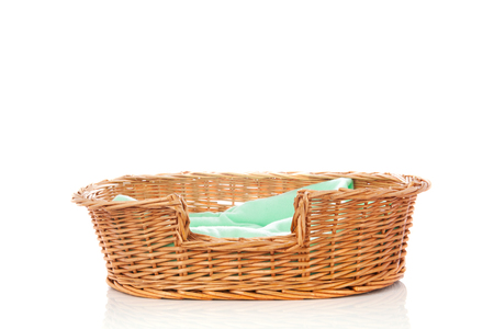 empty animal bed with green blanket isolated over white backgroundの写真素材
