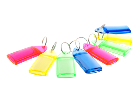 Row colorful key rings isolated over white background