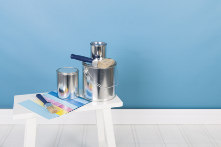 Painting the interior with tins and brushes