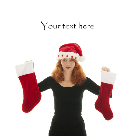 Christmas woman with pair of stocking isolated over white backgroundの写真素材