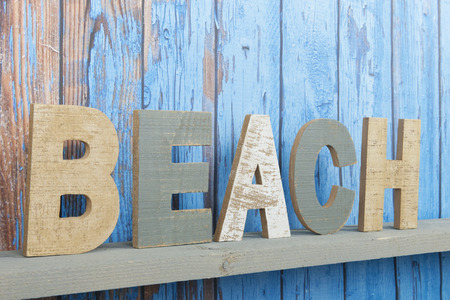 Blue wooden background with vintage beach textの写真素材