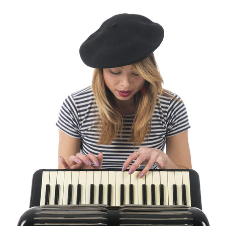 French girl making music with accordion instrument isolated over white background