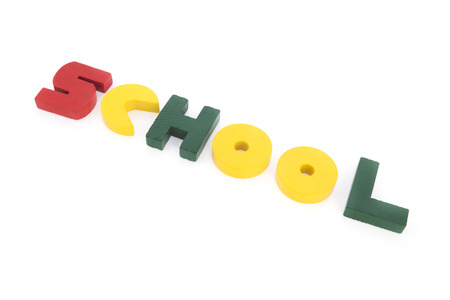 Vintage wooden letters in red, yellow and green making the word school