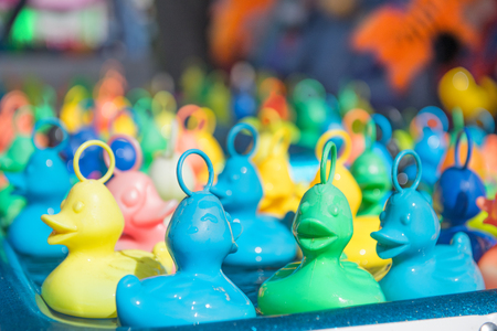 Colorful floating ducks at the fairの写真素材
