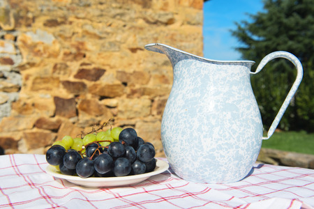 Jar drink and fruit in stillife in the sunの写真素材