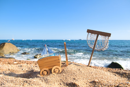 Fishing net in sand at the beachの写真素材