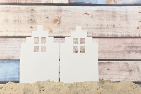 Little metal houses in a row at the beachの写真素材