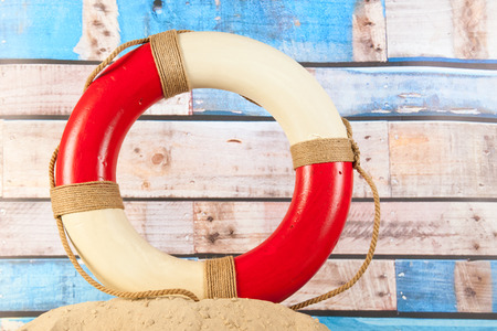 Life buoy at the beach in the sandの写真素材
