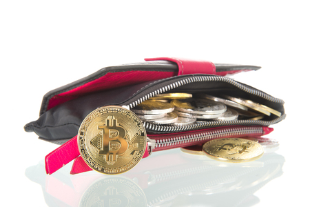Golden and silver bitcoins in wallet isolated over whiteの写真素材
