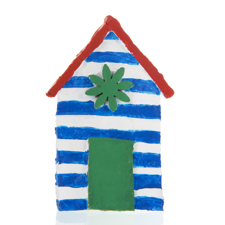 Colorful handmade beach cabin isolated over whiteの写真素材