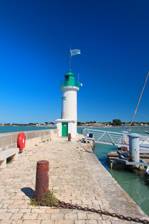 Ile de Re - Lighthouse and boats in the harbor of French village La Flotteの写真素材