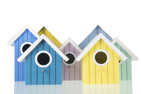 Many colorful bird boxes isolated over white backgroundの写真素材
