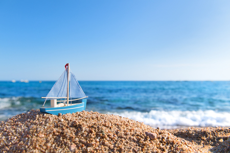 Wooden sail ship at the beachの写真素材