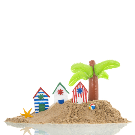 Island with colorful handmade beach cabins isolated over whiteの写真素材