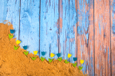 Blue wooden vintage  with sand and flowersの写真素材