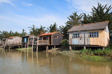 French wooden oyster huts in landscape in the France Charente Maritimeの写真素材