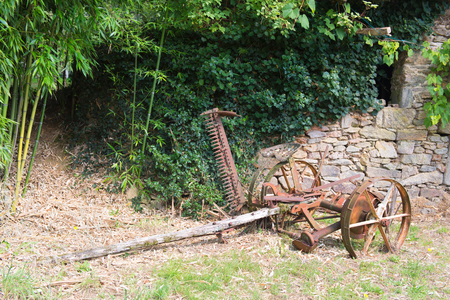 Rusty vintage mowing machine from more then hundred year oldの写真素材