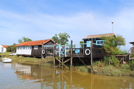 French wooden oyster huts in landscape in the France Charente Maritimeの写真素材