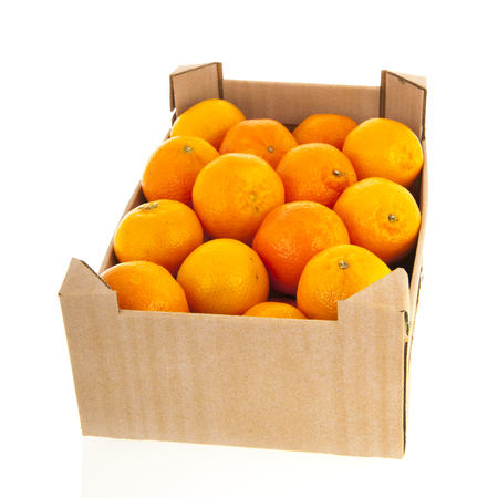 Carton crate tangerines isolated over whiteの写真素材