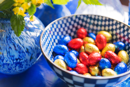 Blue still life with chocolate easter eggsの写真素材