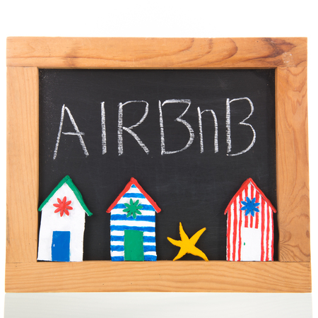 Airbnb written on blackboard isolated over whiteのeditorial素材