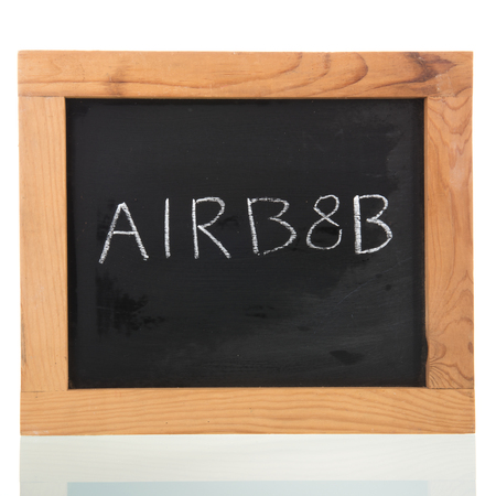 Airbnb written on blackboard isolated over whiteのeditorial素材