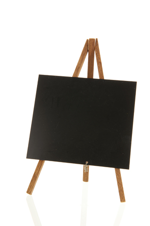 Empty black board isolated over whiteの写真素材