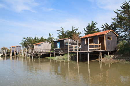 French wooden oyster huts in landscape in the France Charente Maritimeの写真素材