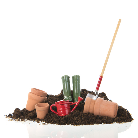 Black heap sand with shovel isolated on whiteの写真素材