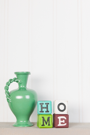 Green vintage vase in interior at homeの写真素材
