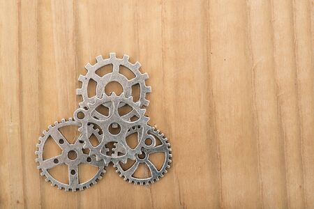 Industrial wheels in silver on woodenの写真素材