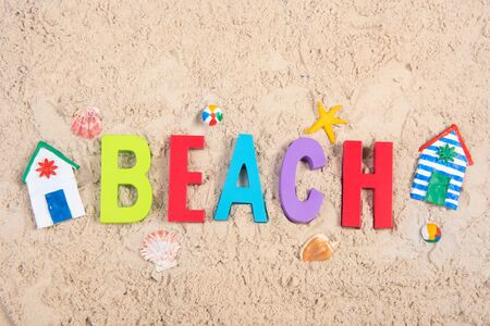Hand made Miniature beach huts in sandの写真素材