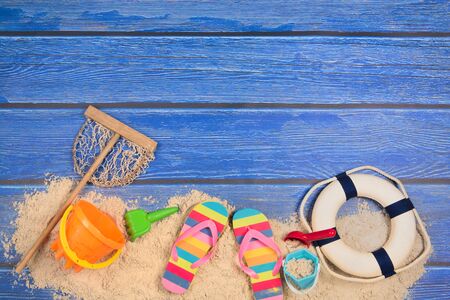 Vacation  with beach sand and blue woodの写真素材