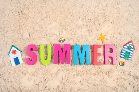Hand made Miniature beach huts in summer sandの写真素材