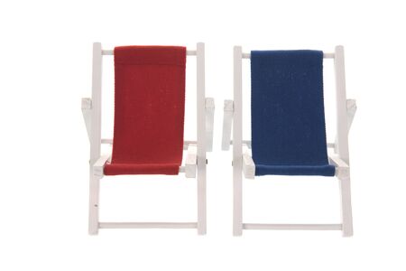 Empty beach chairs in red and blueの写真素材