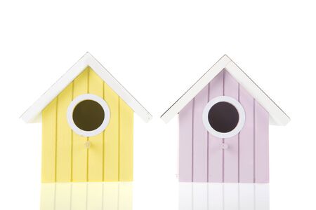 Many colorful bird boxes isolated over white backgroundの写真素材