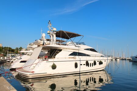 Luxury yacht at pier in harbourの写真素材