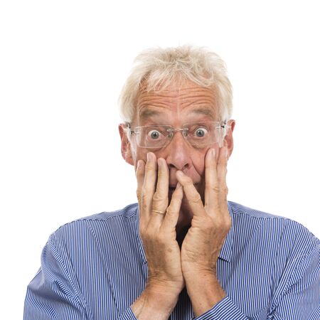 Portrait senior man in shock isolated against white backgroundの写真素材