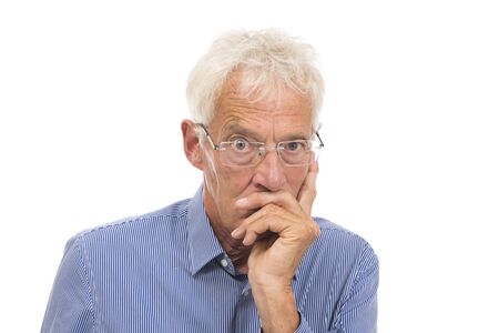 Portrait thinking senior man isolated against white backgroundの写真素材