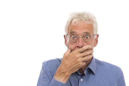 Portrait senior man in shock isolated against white backgroundの写真素材