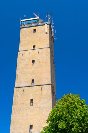 Typical Dutch lighthouse against blue skyの写真素材