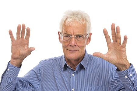 Portrait scaring senior man isolated against white backgroundの写真素材
