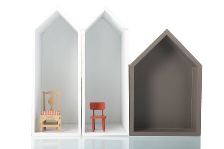 simple houses with furniture in a row isolated over white backgroundの写真素材