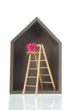 Simple grey wooden house with stairs isolated over white backgroundの写真素材