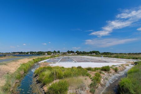 Ile de Re salt lakes wheelbarrow and other toolsの写真素材