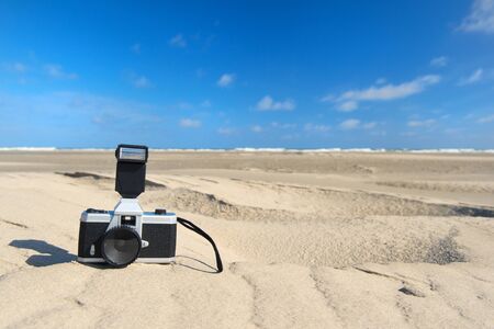 Photo camera in landscape at the beachの写真素材