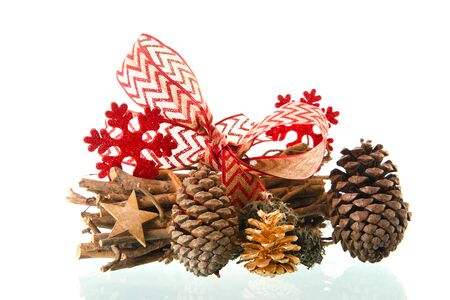 Natural Christmas decoration with wooden bunch branches, snowflakes and bird boxの写真素材