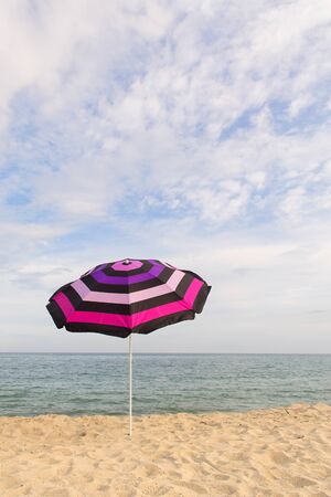 Vacation with shade with umbrella at the beachの写真素材