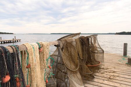 Fishing nets at lake Urbino at French island Corsicaの写真素材